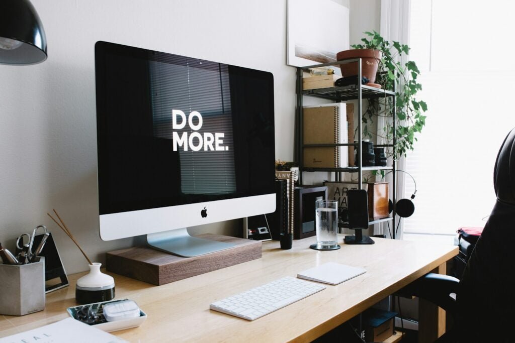 iMac screen displaying the homepage of a small business website, highlighting essential website features.